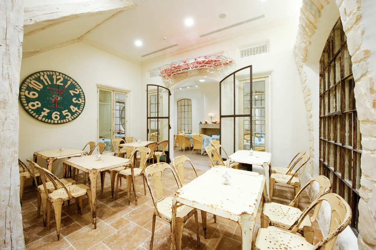 Qu’il fait bon — Grand Maison Ginza — Café interior at grand-maison-ginza from its operator branch gallery; unlabelled display tarts are not identified as current menu items.