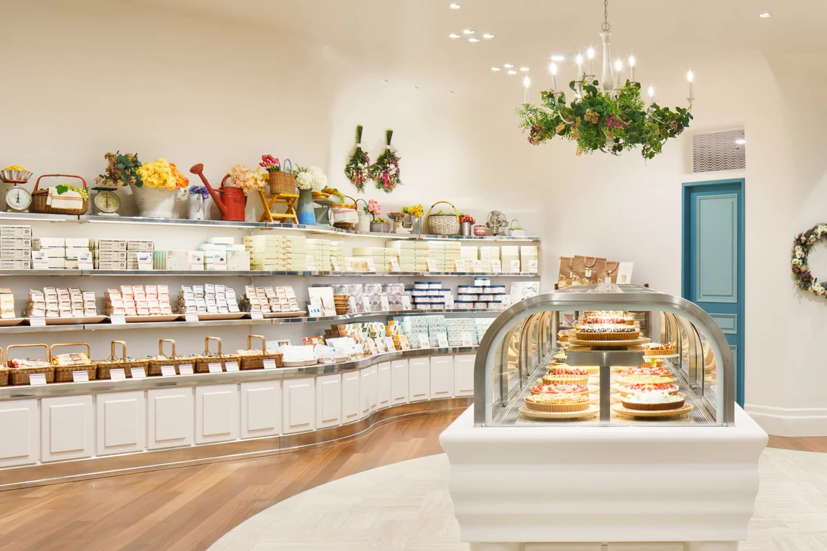 Qu’il fait bon — Tokyo Dome City — Shop interior and tart display at tokyo-dome-city from its operator branch gallery; unlabelled display tarts are not identified as current menu items.