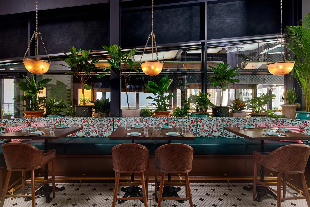 Bar high tops and banquette at Dauphine's
